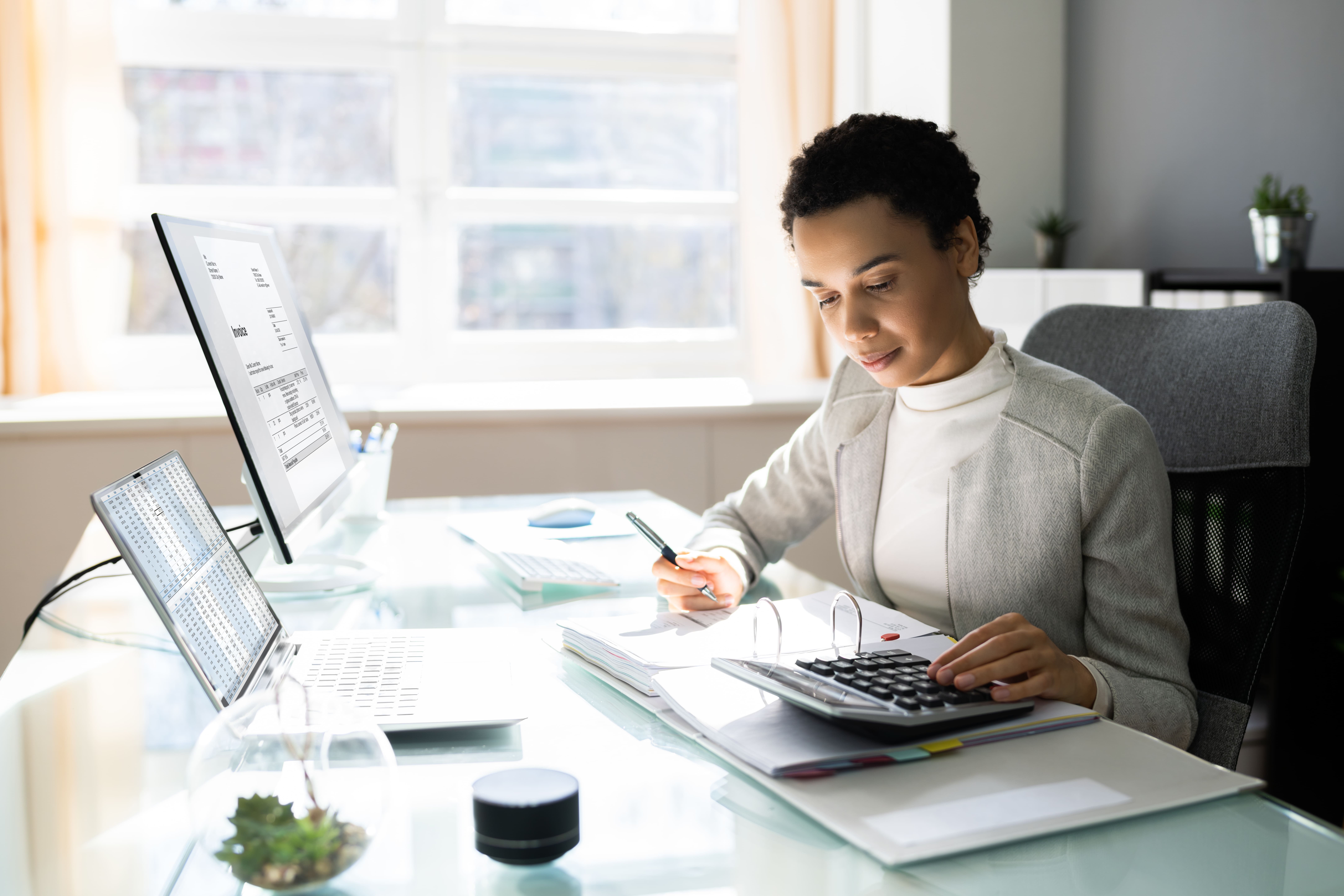 A young woman doing some calculations